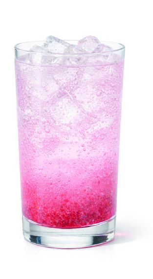 A tall glass of berry electrolyte refresher with crushed raspberries and ice.